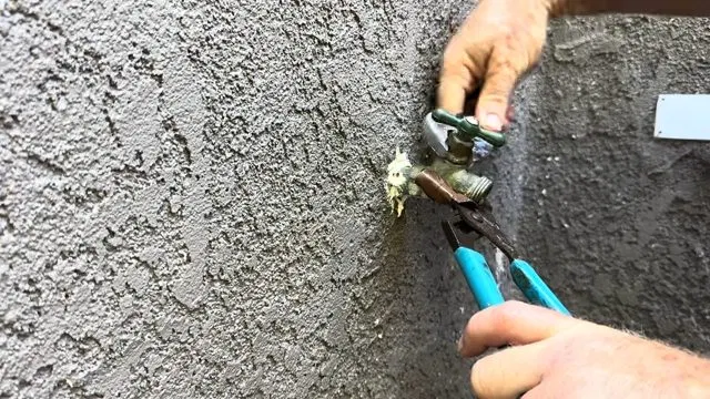 Pointing To Hose Bib Packing Nut shown for Is Tankless Worth It for a Dallas, GA Home on Propane? in Dallas, Georgia.