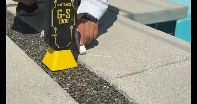 Pool Leak Detector Scanning Deck Edge shown for Slab Leak or Something Else? What Dallas, GA's Clay Soil Actually Does in Dallas, Georgia.