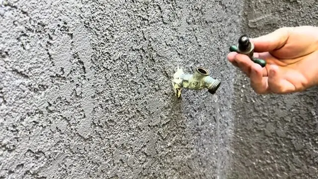 Pulling Worn Washer From Hose Bib Stem shown for Is a Slow Drain an Emergency on a Dallas, GA Septic System? in Dallas, Georgia.