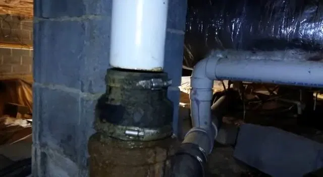 PVC Stack Joined To Old Crawlspace Drain shown for How Often Does a Septic Tank Actually Need Pumping in Paulding County? in Dallas, Georgia.