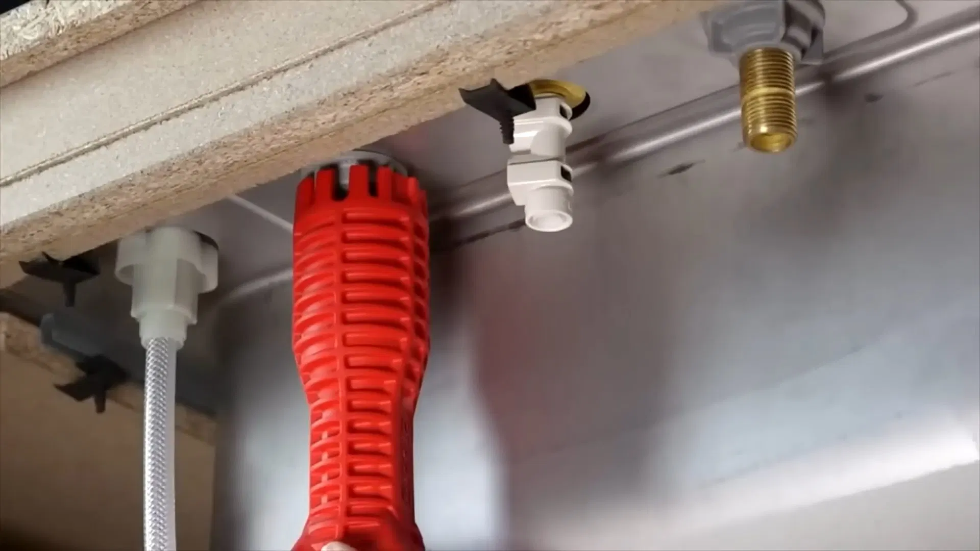 Red Drain Hose Connected To Sink shown for How Often Does a Septic Tank Actually Need Pumping in Paulding County? in Dallas, Georgia.