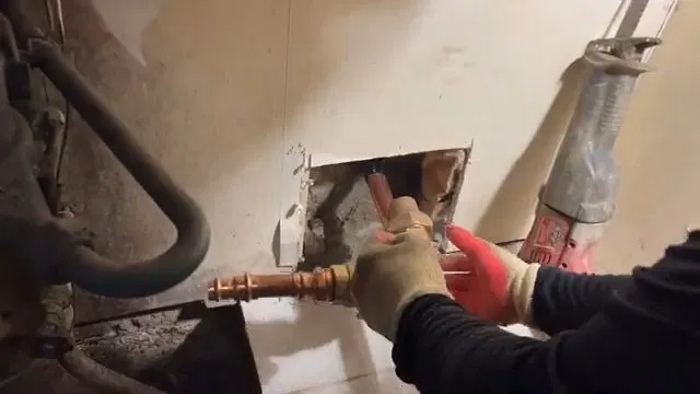 Removed Lead Service Pipe Covered In Soil shown for How Many Pinhole Leaks Before a Dallas, GA Home Needs a Full Repipe? in Dallas, Georgia.