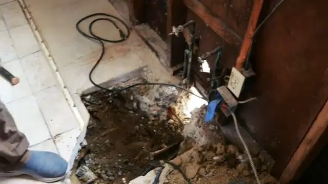 Removing Damaged Sewer Pipe Section shown for How Many Pinhole Leaks Before a Dallas, GA Home Needs a Full Repipe? in Dallas, Georgia.