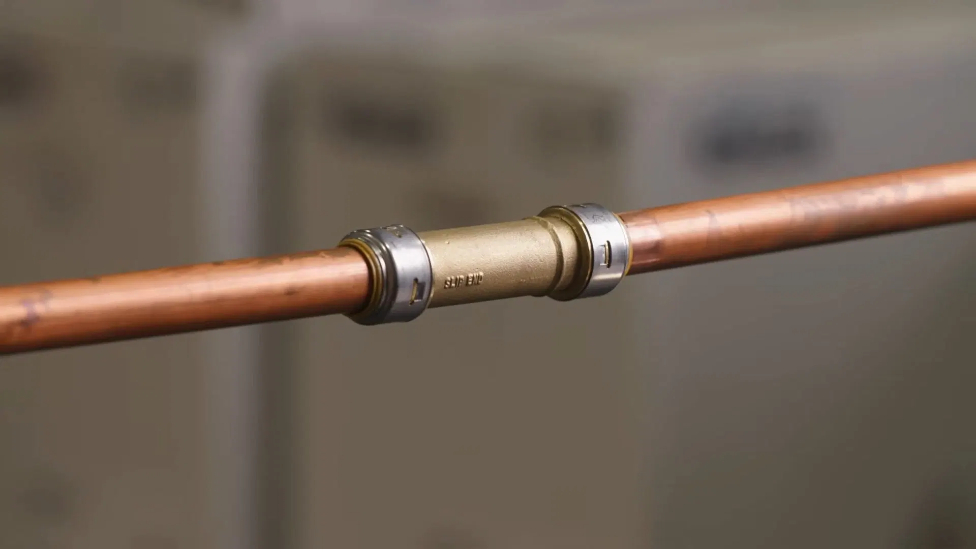 Repaired Copper Pipe With Metal Coupling shown for Repiping in Dallas, GA in Dallas, Georgia.