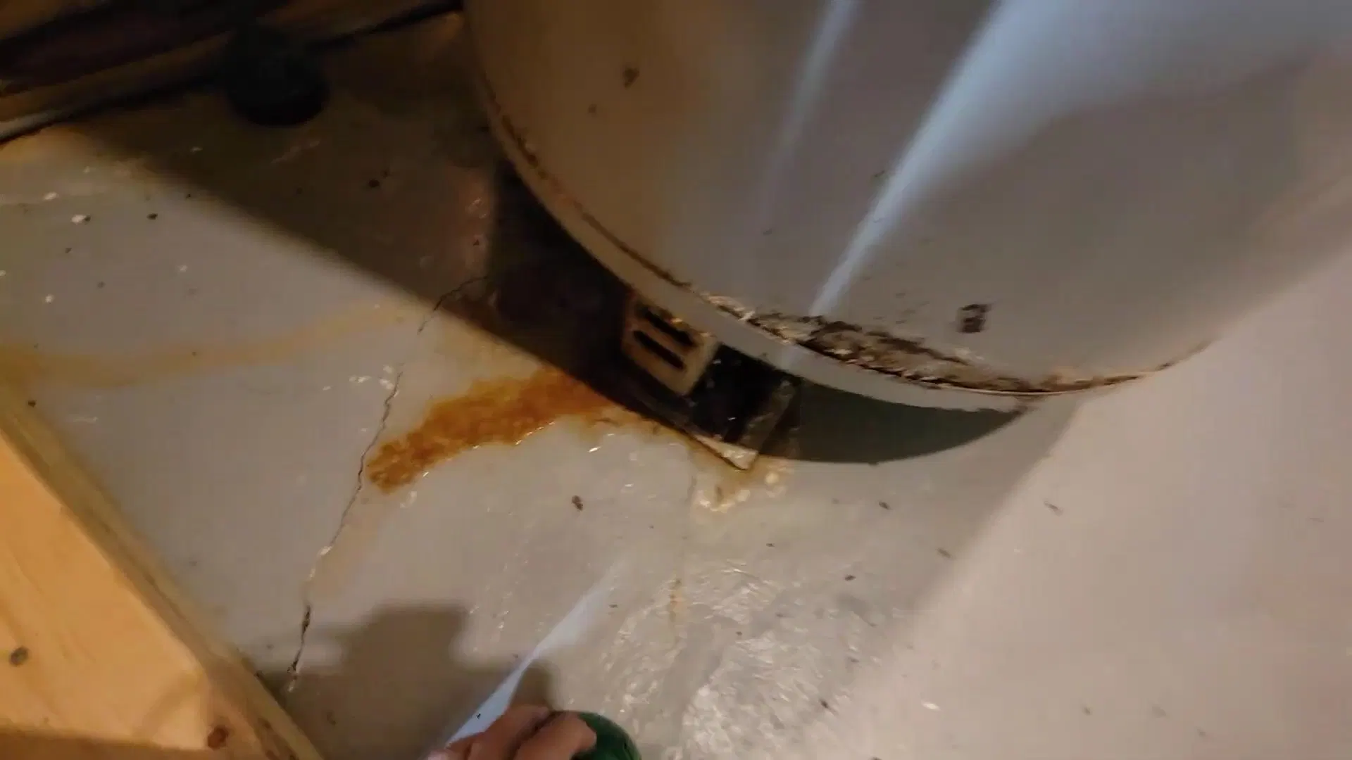Rust Stain Below Old Water Heater shown for Water Heater Installation & Replacement in Dallas, GA in Dallas, Georgia.