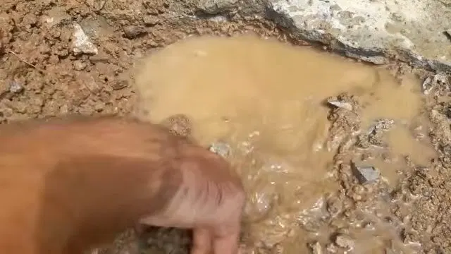Rusted Cast Iron Cleanout Fitting In Wall shown for Why Does Our Drain Keep Clogging Again After It's Been Snaked? in Dallas, Georgia.