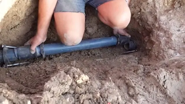 Sliding Repair Coupling Onto Water Line shown for Water Heater Repair in Dallas, GA in Dallas, Georgia.