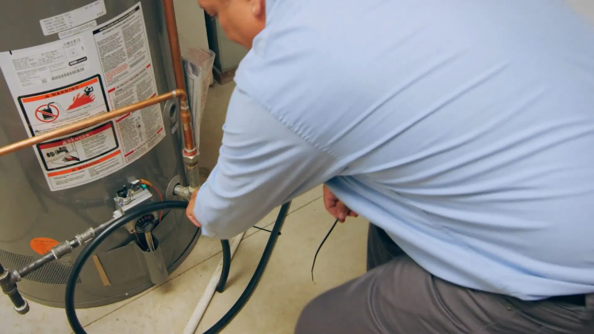 Technician Fitting Water Softener Bypass shown for Water Heater Repair in Dallas, GA in Dallas, Georgia.