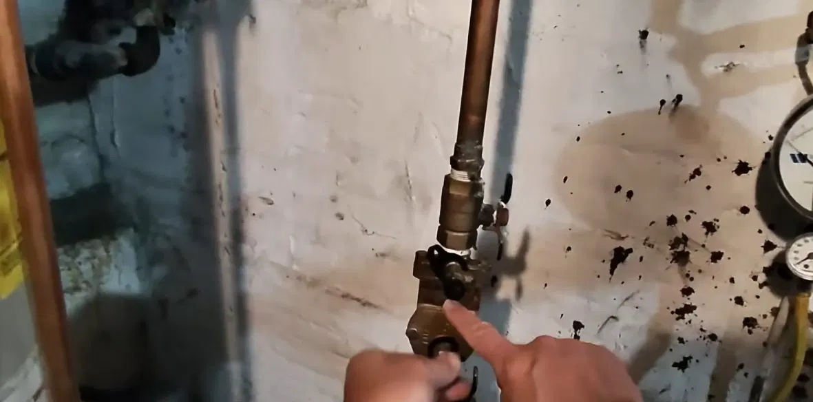 Technician Handling Backflow Test Gauge shown for Areas we serve near Dallas, GA in Dallas, Georgia.