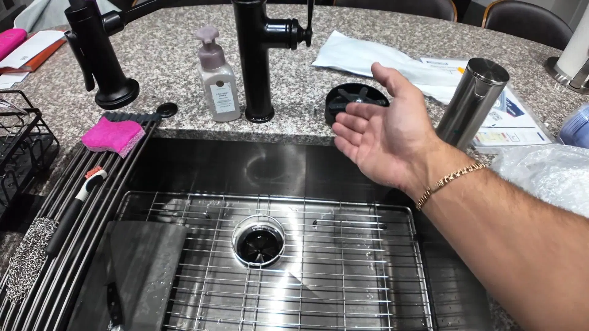 Technician Working Beside Kitchen Sink shown for Plumbing services in Dallas, GA in Dallas, Georgia.