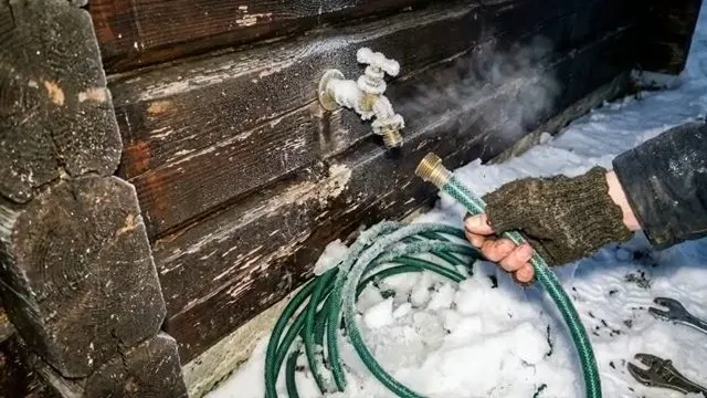 Thawing Exterior Hose Bib In Snow shown for Why Does Our Faucet Keep Dripping After We Already Fixed It? in Dallas, Georgia.