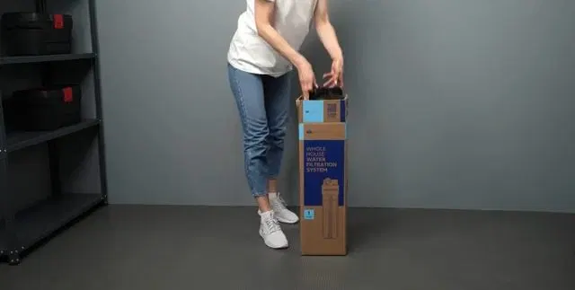 Unboxing Whole House Water Filter System shown for Water Heater Repair in Dallas, GA in Dallas, Georgia.