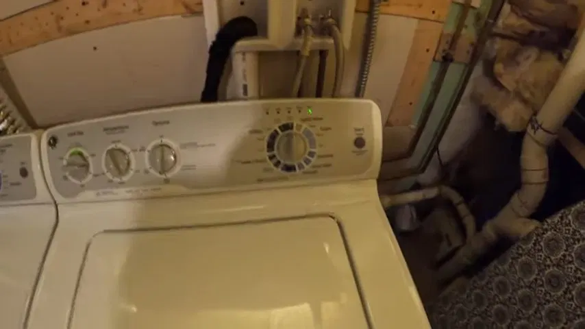 Washer Positioned Near Basement Water Supply shown for Water Heater Repair in Dallas, GA in Dallas, Georgia.