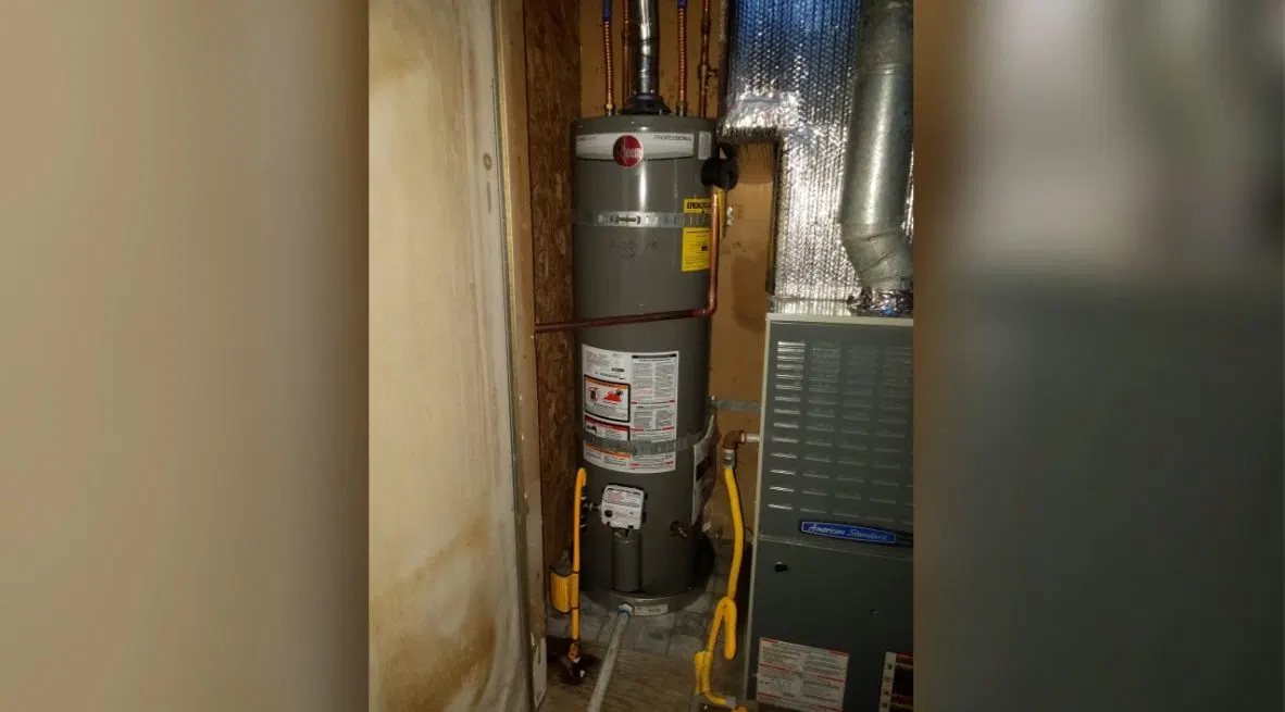Water Heater In Cupboard shown for Tankless Water Heater in Dallas, GA in Dallas, Georgia.