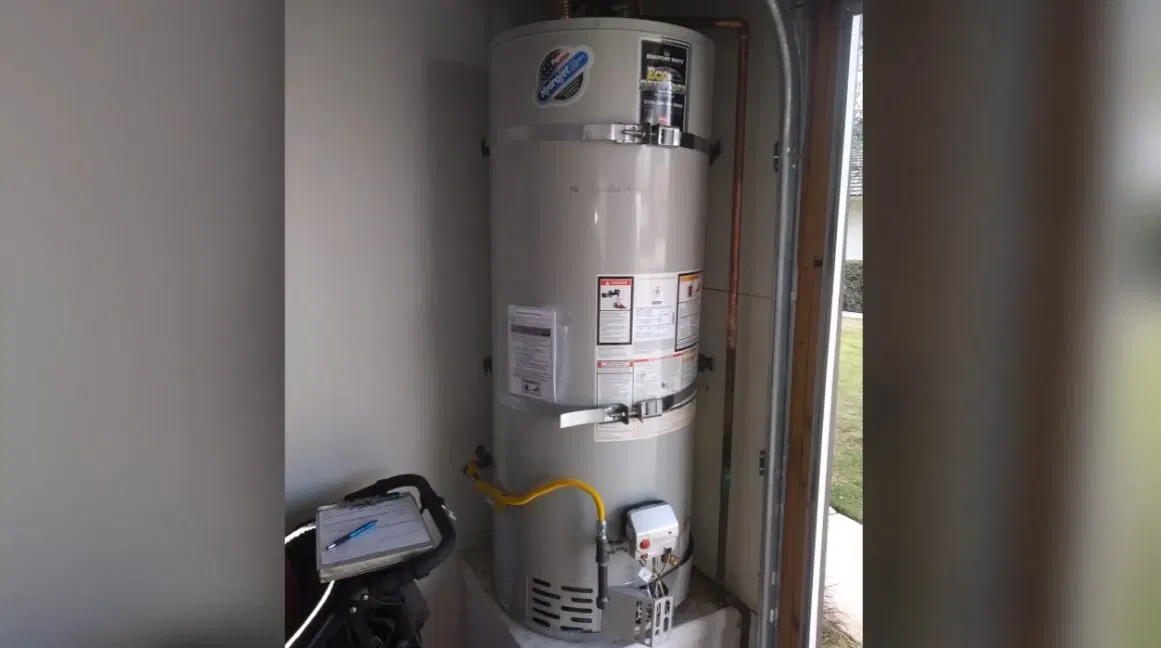 Water Heater Inside Utility Closet shown for Tankless Water Heater in Dallas, GA in Dallas, Georgia.