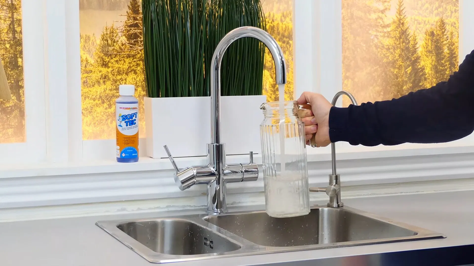 Water Running From Kitchen Tap Into Glass shown for A Running Toilet on a Septic System: What It's Actually Costing You in Dallas, Georgia.