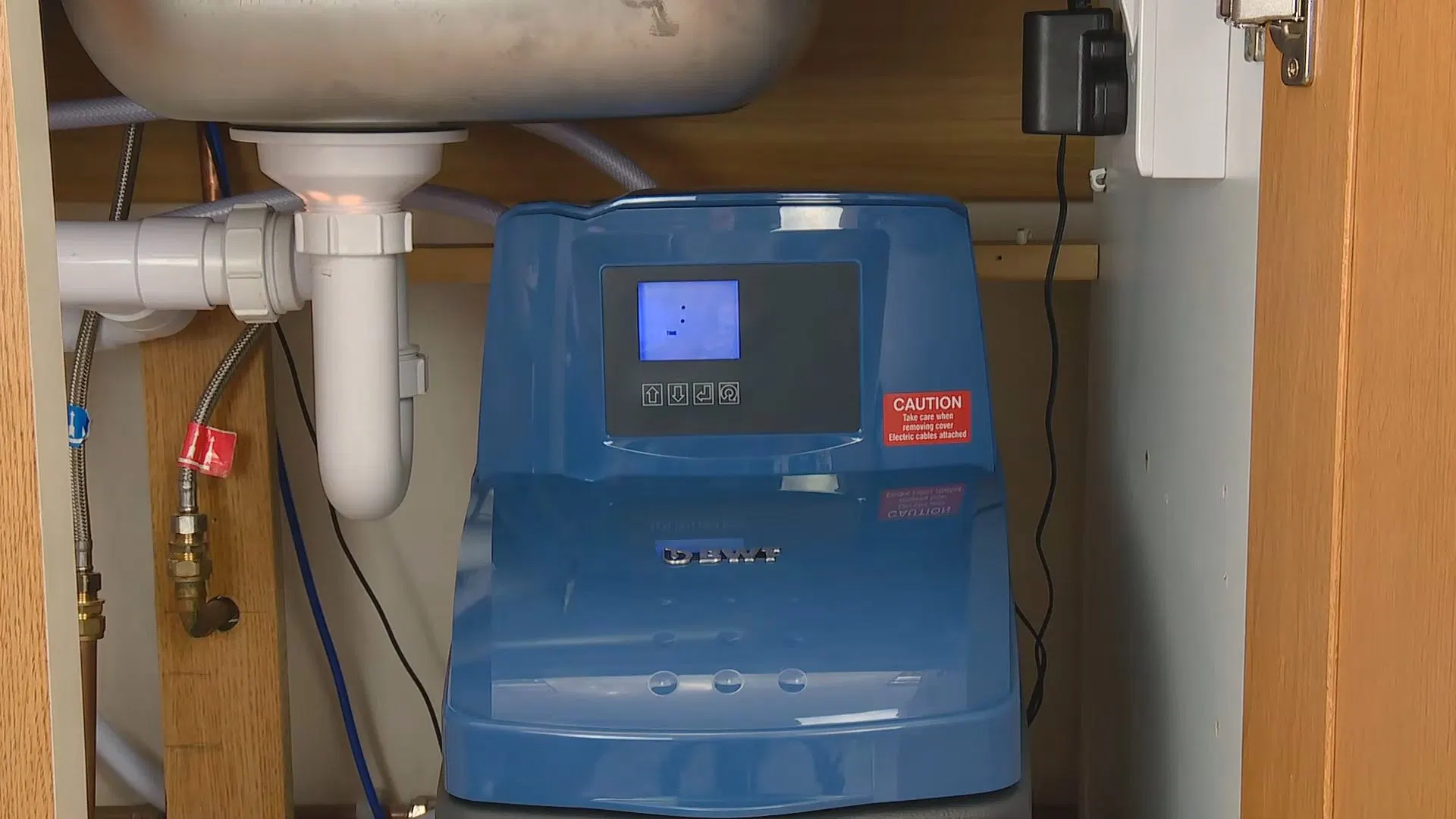 Water Softener Connected Beneath Sink shown for Water Filtration Systems in Dallas, GA in Dallas, Georgia.