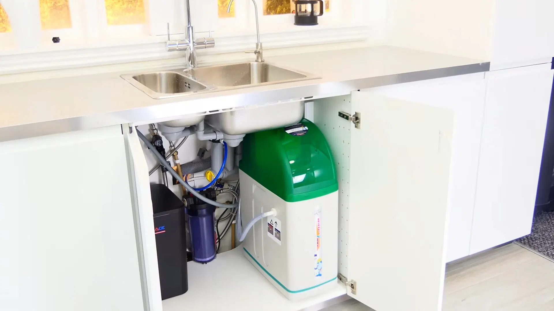 Water Softener Installed Beneath Kitchen Sink shown for City Water or Well Water: What Actually Needs Filtering in Paulding County? in Dallas, Georgia.