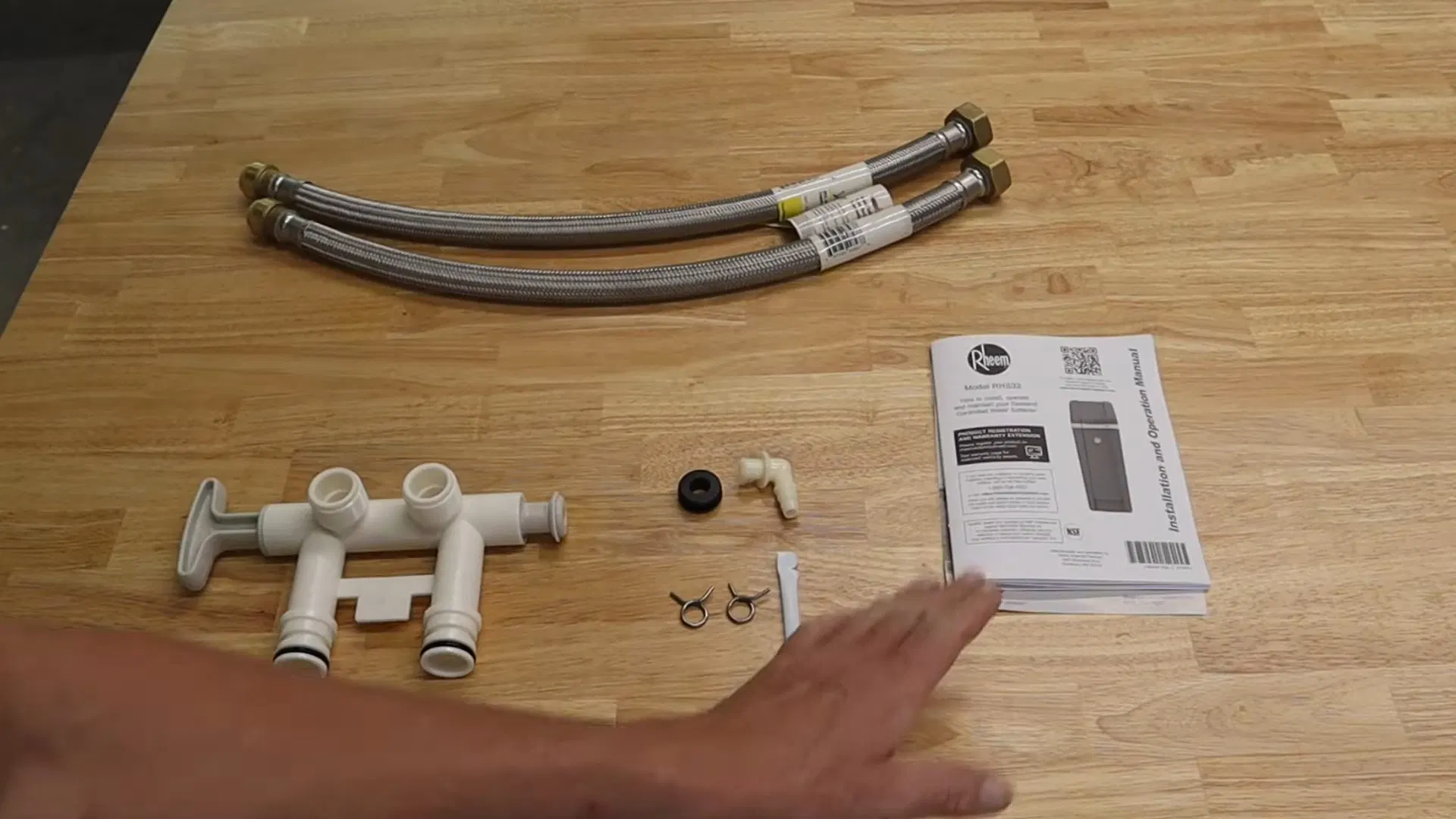 Water Softener Parts Laid Out On Workbench shown for Water Filtration Systems in Dallas, GA in Dallas, Georgia.