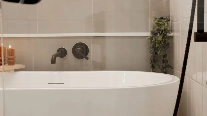 White Bathtub With Dark Shower Fixtures shown for Toilet Repair & Installation in Dallas, GA in Dallas, Georgia.