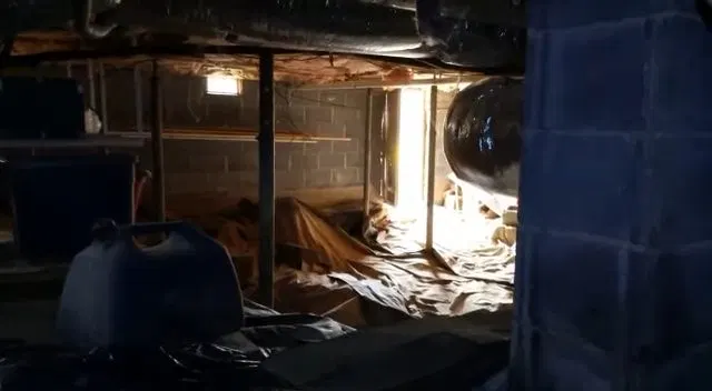 Wide View Of Home Crawlspace Plumbing shown for Water Heater Repair in Dallas, GA in Dallas, Georgia.