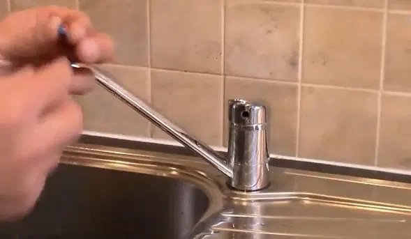 Wiping Down Faucet After Reassembly shown for Why Does Our Faucet Keep Dripping After We Already Fixed It? in Dallas, Georgia.