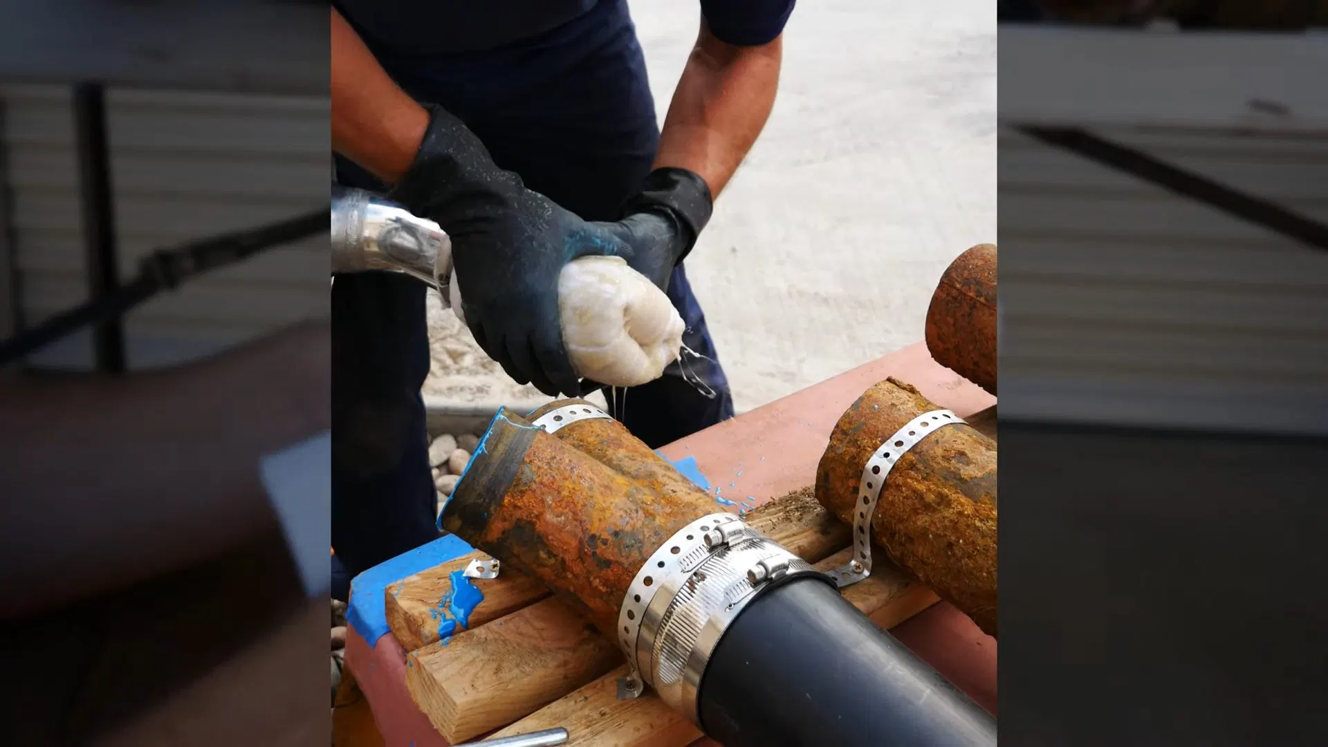 Worker Fitting Coupling On Underground Sewer shown for Septic Tank Service in Dallas, GA in Dallas, Georgia.
