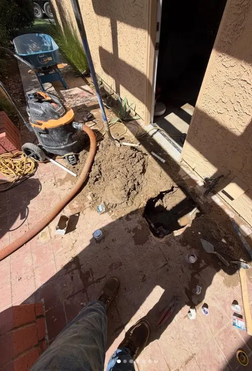 Worker Saw Cutting Concrete Slab shown for Slab Leak Detection & Repair in Dallas, GA in Dallas, Georgia.